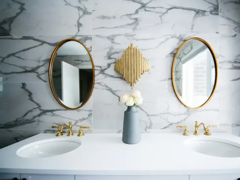 Bathroom remodel in San Antonio Tx — a craftsperson easing the last imperfection out of the work by hand